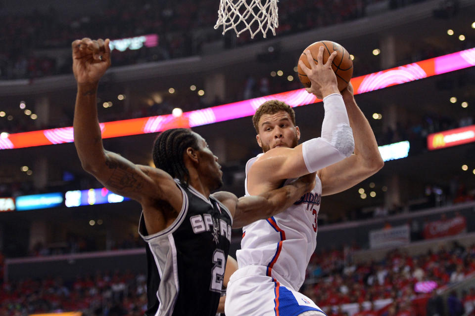 LOS ANGELES, CA - MAY 20: Blake Griffin #32 of the Los Angeles Clippers grabs a rebound against Kawhi Leonard #2 of the San Antonio Spurs in the first quarter in Game Four of the Western Conference Semifinals in the 2012 NBA Playoffs on May 20, 2011 at Staples Center in Los Angeles, California. NOTE TO USER: User expressly acknowledges and agrees that, by downloading and or using this photograph, User is consenting to the terms and conditions of the Getty Images License Agreement. (Photo by Harry How/Getty Images)