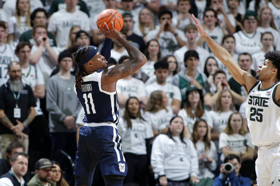 Butler's Jahmyl Telfort, left, shoots against Michigan State's Malik Hall during the first half of an NCAA college basketball game Friday, Nov. 17, 2023, in East Lansing, Mich. (AP Photo/Al Goldis)