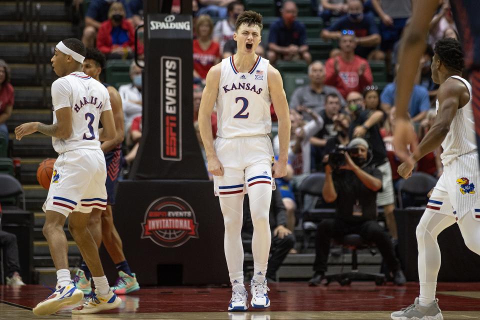 Nov 26, 2021; Orlando, FL, USA; Kansas Jayhawks guard Christian Braun (2) celebrates a dunk against Dayton Flyers in the first half at HP Fieldhouse Mandatory Credit: Jeremy Reper-USA TODAY Sports