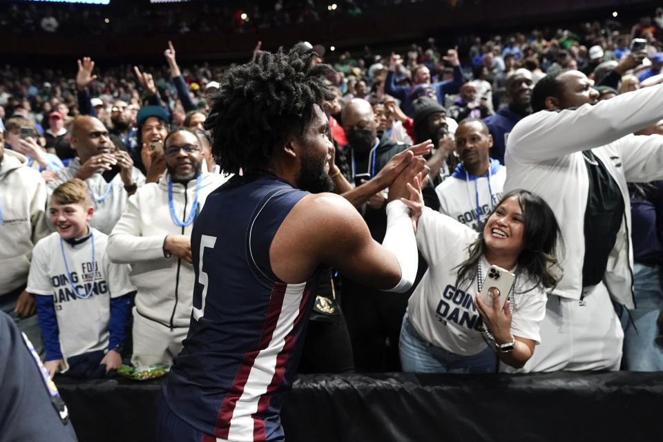 Fairleigh Dickinson forward Ansley Almonor (5) celebrates beating Purdue 63-58 after a first-round college basketball game in the NCAA Tournament Friday, March 17, 2023, in Columbus, Ohio. (AP Photo/Paul Sancya)