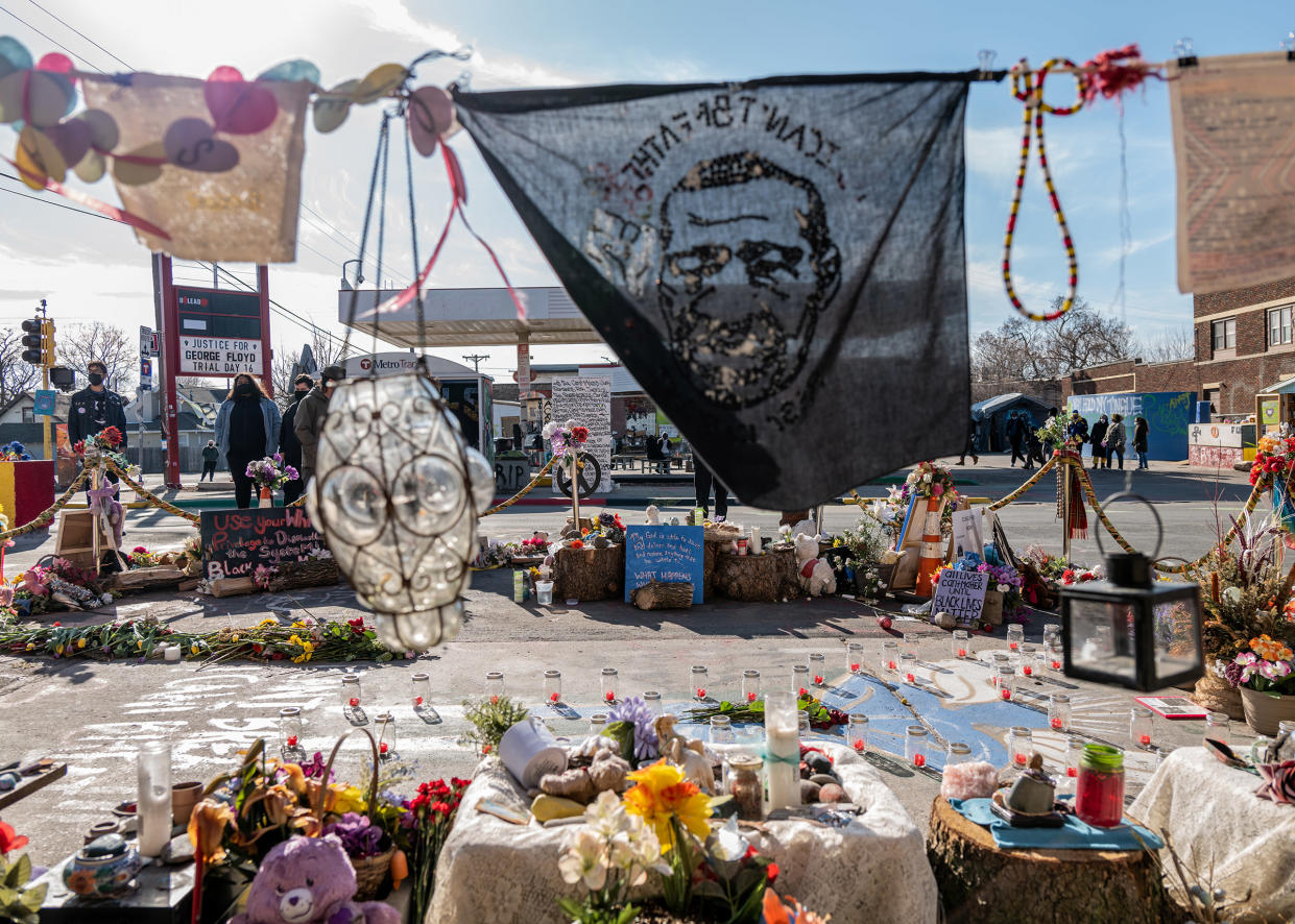 A handkerchief bearing the image of George Floyd wafts in the cold air as if to fan the spirit of George Floyd over the Square where he was slain.