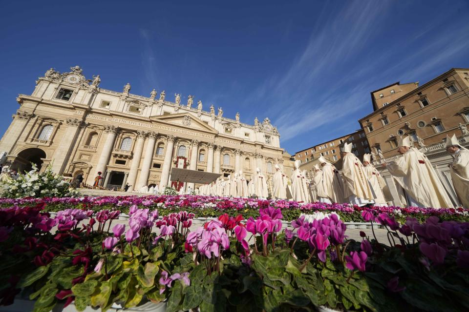 Prelates arrive for a mass presided over by Pope Francis and concelebrated by the new cardinals for the start of the XVI General Assembly of the Synod of Bishops in St. Peter's Square at The Vatican, Wednesday, Oct.4, 2023. Pope Francis is convening a global gathering of bishops and laypeople to discuss the future of the Catholic Church, including some hot-button issues that have previously been considered off the table for discussion. Key agenda items include women's role in the church, welcoming LGBTQ+ Catholics, and how bishops exercise authority. For the first time, women and laypeople can vote on specific proposals alongside bishops (AP Photo/Andrew Medichini)