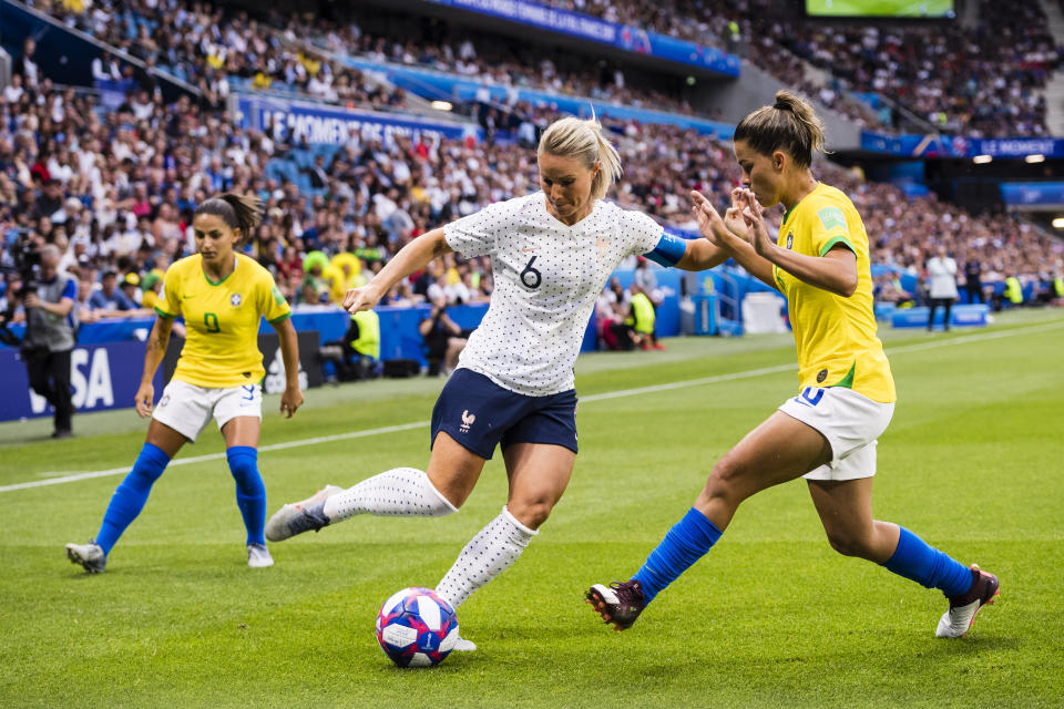 Amandine Henry of France (L) in action against Tamires Britto of Brazil (R) during the 2019 FIFA Women's World Cup France Round Of 16 match between France and Brazil at Stade Oceane on June 23, 2019 in Le Havre, France. (Photo by Marcio Machado/Getty Images)