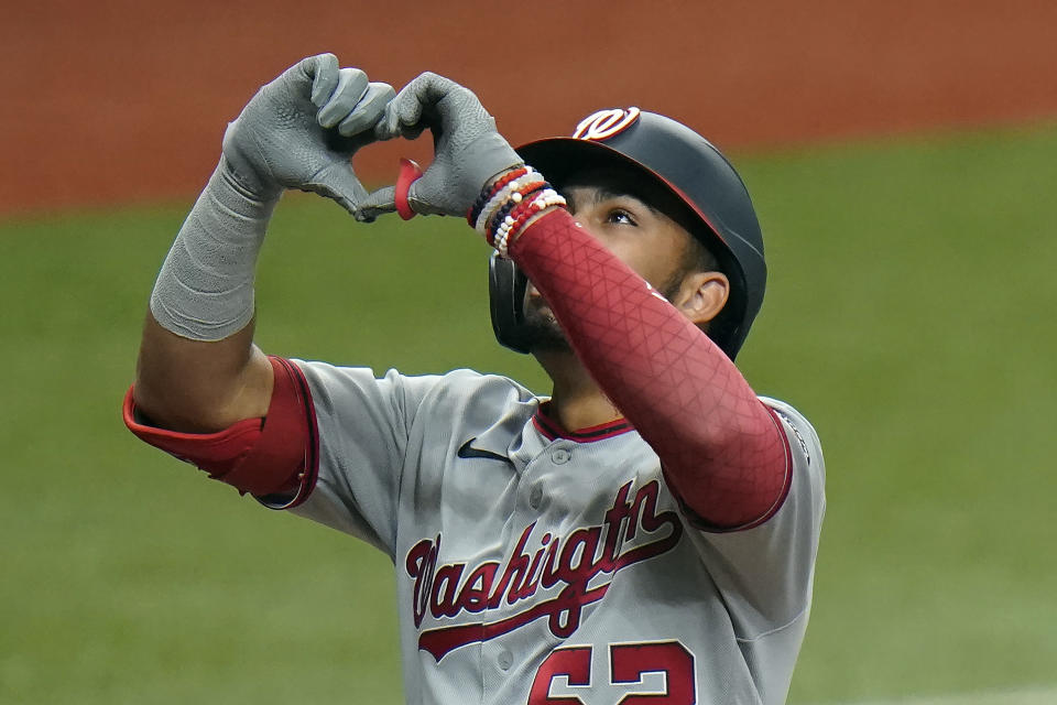 Washington Nationals' Luis Garcia (62) celebrates his two-run home run off Tampa Bay Rays relief pitcher Nick Anderson during the 10th inning of a baseball game Wednesday, Sept. 16, 2020, in St. Petersburg, Fla. (AP Photo/Chris O'Meara)