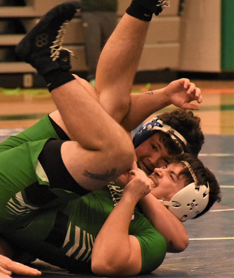 Mt. Markham Mustang Kadyn Derby wraps up Herkimer Magician Max Polus (foreground) on his way to a win at 190 pounds Tuesday.