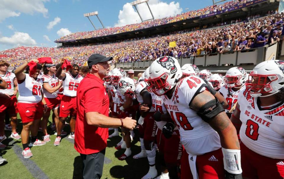 N.C. State head coach Dave Doeren prepares to lead the Wolfpack onto the field before N.C. State’s 21-20 victory over ECU at Dowdy-Ficklen Stadium in Greenville, N.C., Saturday, Sept. 3, 2022.