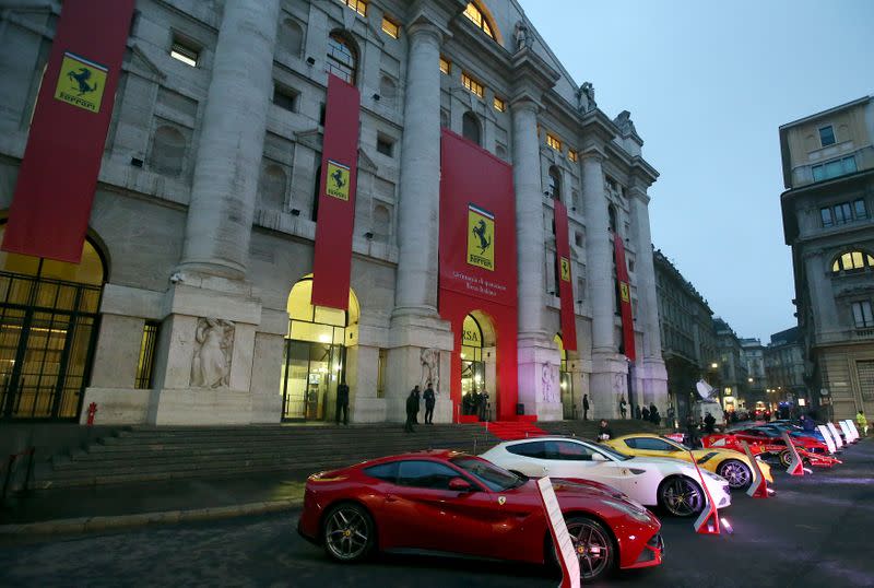 Ferrari's model cars are seen in front of the Milan's stock exchange