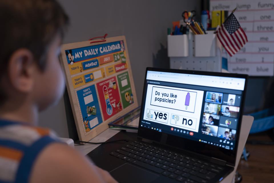 Logan Strauss, 5, participates in an online class from home in Basking Ridge, N.J., in July. Logan’s parents are keeping him out of school until he is able to get the COVID-19 vaccine.