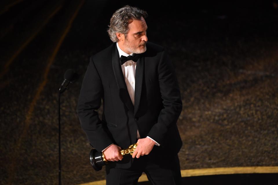 Joaquin Phoenix accepts his first Oscar, best actor for his role in "Joker."