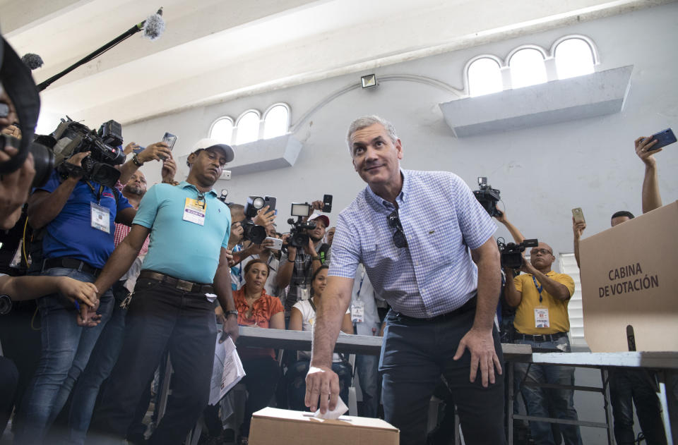 Gonzalo Castillo, who is seeking the presidential nomination of his party, the Dominican Liberation Party, votes during primary elections in Santo Domingo, Dominican Republic, Sunday, Oct. 6, 2019. Castillo went on to win his party's nomination. (AP Photo/Tatiana Fernandez)