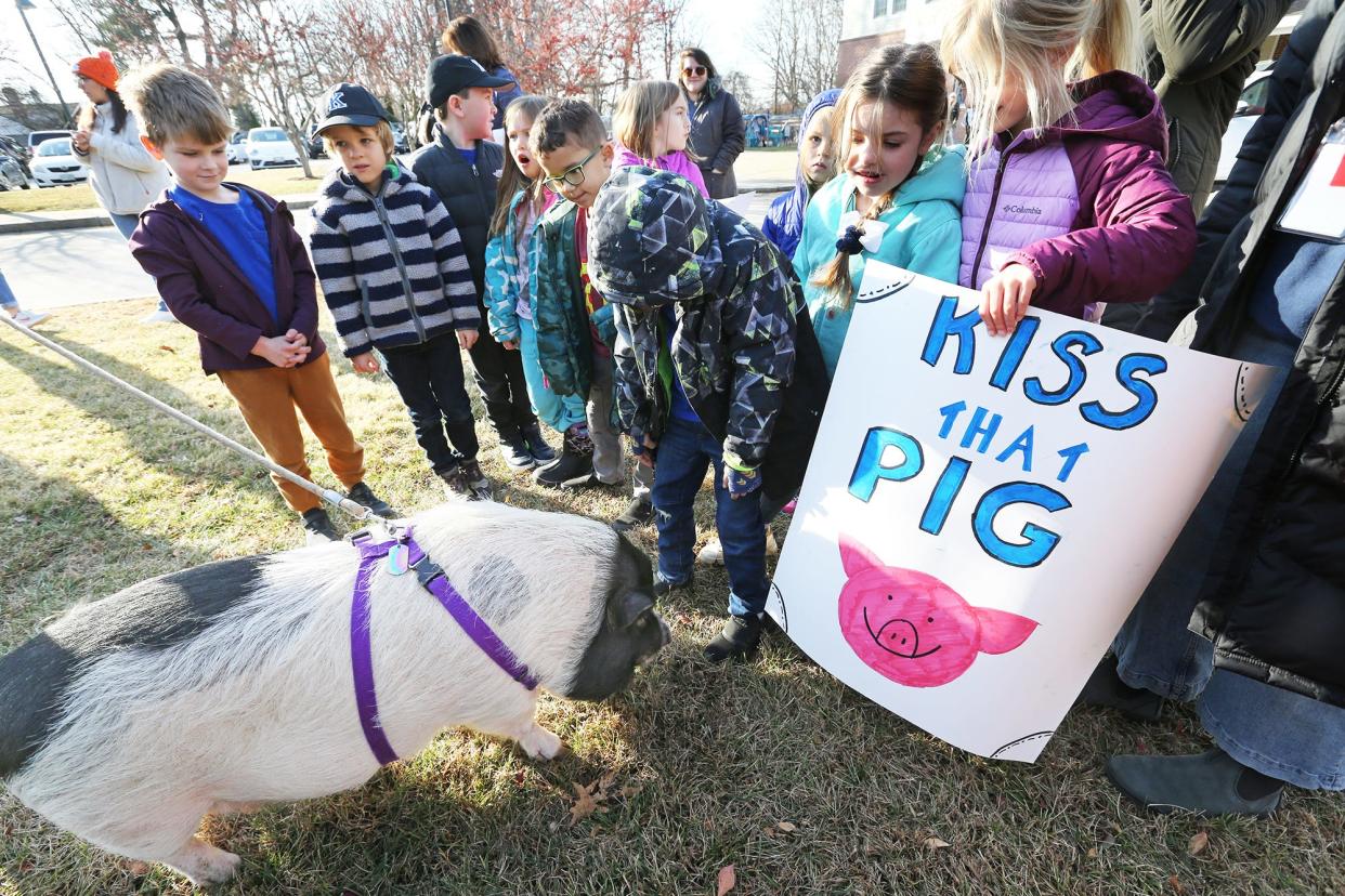 Horace Mitchell Primary School Principal Allison Gamache challenged students at the school to read 1,000 books. They did, and Gamache followed through on her end of the deal, kissing a pig in front of the entire school Friday, Dec. 1, 2023.