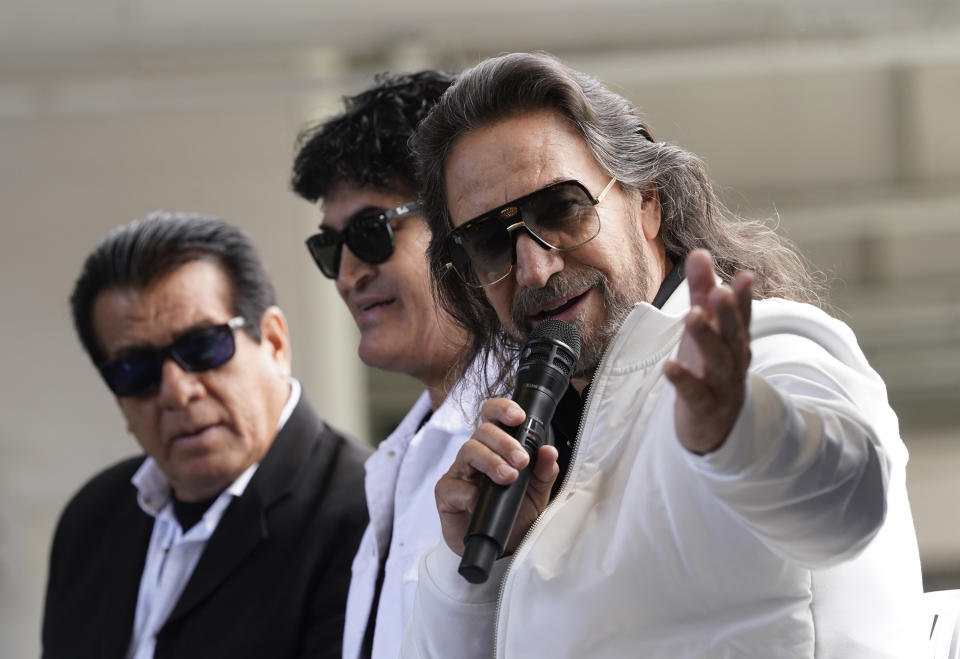 Members of the Mexican grupera band Los Bukis, from left, Pedro Sanchez, Roberto Guadarrama and Marco Antonio Solis attend a press conference at SoFi Stadium on Monday, June 14, 2021, in Inglewood, Calif. Twenty five years after their last show as a band, the group announced that they are reuniting for a U.S. tour. (AP Photo/Chris Pizzello)