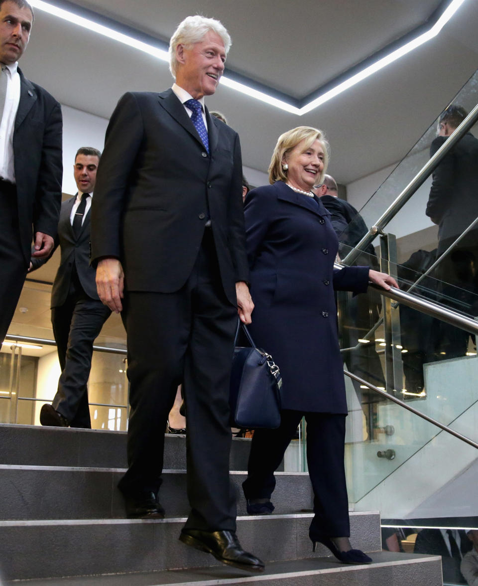 JOHANNESBURG, SOUTH AFRICA - DECEMBER 10:  Former U.S. President Bill Clinton and former Secretary of State Hillary Clinton leave the official memorial service for former South African President Nelson Mandela at FNB Stadium December 10, 2013 in Johannesburg, South Africa. (Photo by Chip Somodevilla/Getty Images)