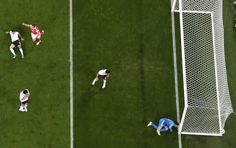 Egypt's goalkeeper Mohamed El Shenawy (R) watches as the ball ends up in his net after a deflection by Egypt's defender Ahmed Fathi (L) - Credit: AFP/Getty