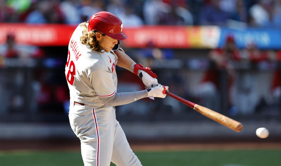 Phillies' Alec Bohm hits a single against the New York Mets during the first inning of a baseball game, Sunday, Oct. 1, 2023, in New York. (AP Photo/Noah K. Murray)