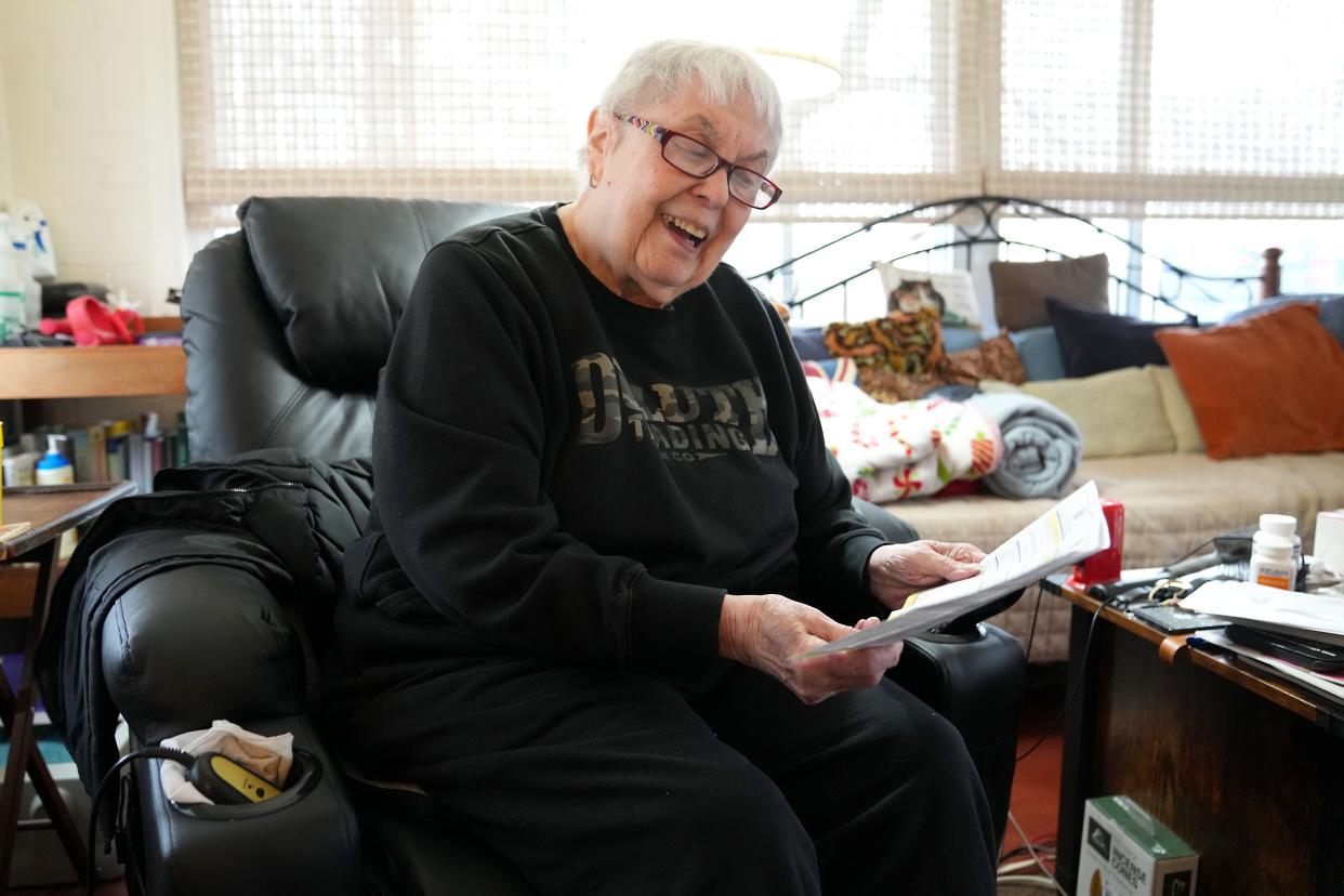 Widowed and retired homeowner Carol Kahn reacts after viewing her Hamilton County property tax documents, which shot up more than $1,800 a year in the latest property reassessment from the county, pictured, Friday, Jan. 26, 2024, at her home in Amberley Village, Ohio.