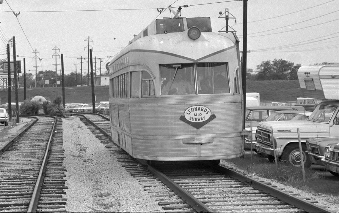 Nov. 17, 1971: M&O Subway car on the tracks by parked cars in Leonard’s Department Store parking lot, Fort Worth.