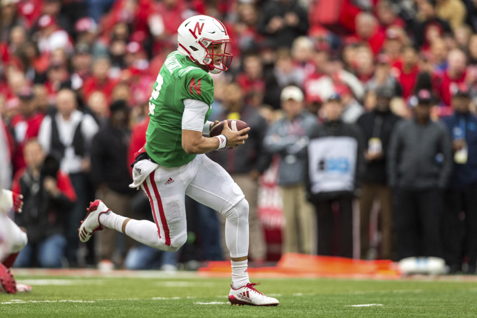 Nebraska red team quarterback Adrian Martinez (2) runs the ball for a touchdown during the Red/White spring football game in Lincoln. (AP Photo/John Peterson)