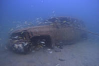 A sunken vehicle sit in the Mesaieed sea-line at the GMC dive site in Mesaieed, Qatar Wednesday, Nov. 30, 2022. World Cup fans in Qatar hoping to see some of the Gulf’s marine life are visiting the artificial reefs just off the coast of the small, peninsular Arab nation. The underwater installations of stripped-out vehicles, bicycles, concrete blocks and toilets attract divers across the Gulf Arab world and elsewhere. (AP Photo/Abbie Parr)