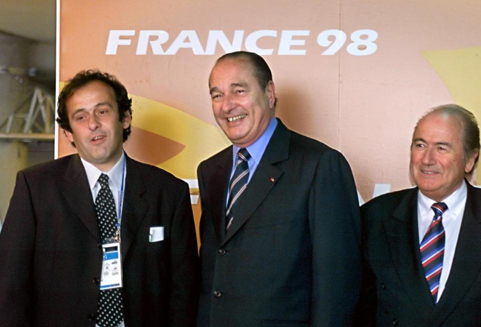 French Organizing committee (CFO) co-chairman, Michel Platini (L), French President Jacques Chirac (C) and newly elected FIFA president, Sepp Blatter of Switzerland, pose for photographers 10 June at the Stade de France in Saint Denis before the opening ceremony of the 1998 Soccer World Cup. (Photo credit should read ERIC CABANIS/AFP via Getty Images)