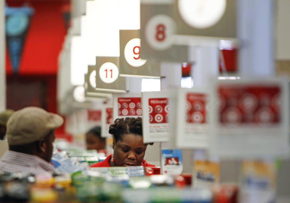 In this Wednesday, Aug. 22, 2012, photo, a cashier rings up a sale at a Target store in Chicago on Wednesday, Aug. 22, 2012. A private research group says that consumer confidence unexpectedly fell in August to the lowest level since November 2011, as Americans' outlook about jobs flared up. The New York-based Conference Board said Tuesday, Aug. 28, 2012, that its Consumer Confidence Index fell to 60.6, down from a revised 65.4 in July. Economists had expected a reading of 66. The index now stands at the lowest point since November 2011 when the reading was at 55.2. (AP Photo/Sitthixay Ditthavong)