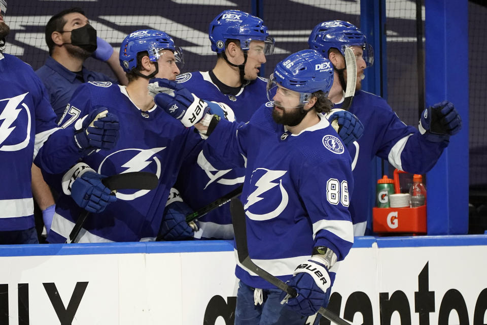 Tampa Bay Lightning right wing Nikita Kucherov (86) celebrates his goal against the Florida Panthers with the bench during the third period in Game 4 of an NHL hockey Stanley Cup first-round playoff series Saturday, May 22, 2021, in Tampa, Fla. (AP Photo/Chris O'Meara)