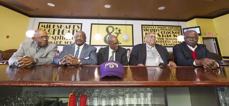 Friendship Nine members Willie Thomas Massey, Willie E. McCleod, James F. Wells, Clarence Graham and David Williamson Jr. (L-R) sit at the lunch counter at Five & Dine diner in Rock Hill, South Carolina, December 17, 2014. REUTERS/Jason Miczek