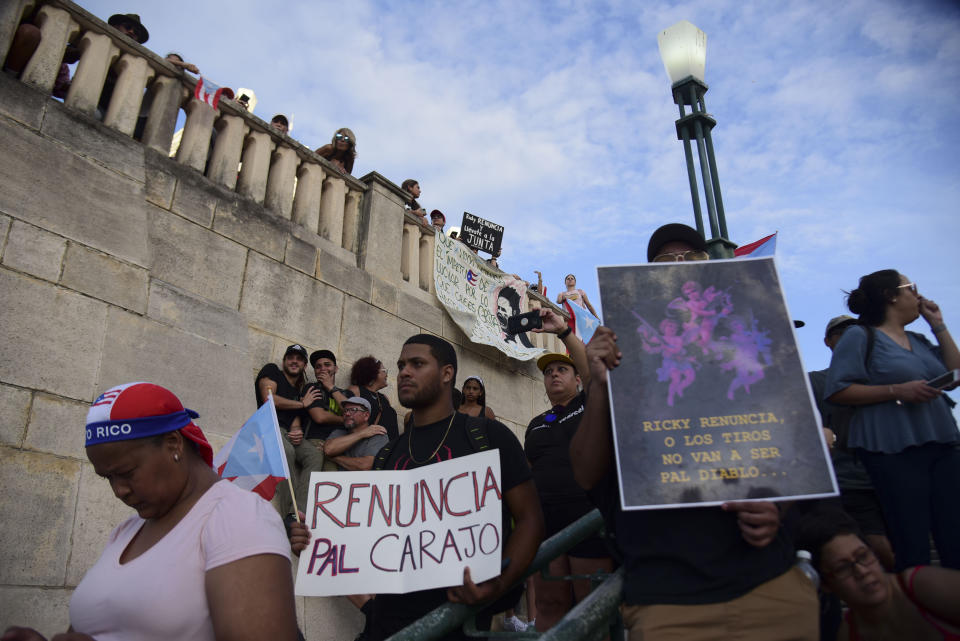 Citizens gather at the Quinto Centenario Plaza to protest against governor Ricardo Rossello, in San Juan, Puerto Rico, Wednesday, July 17, 2019. Protesters are demanding Rossello step down for his involvement in a private chat in which he used profanities to describe an ex-New York City councilwoman and a federal control board overseeing the island's finance. (AP Photo/Carlos Giusti)