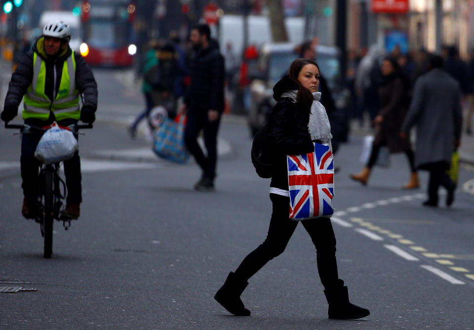 Changing High Street: A woman carries shopping in a plastic bag, in London, Britain December 27, 2018. Photo: REUTERS/Henry Nicholls