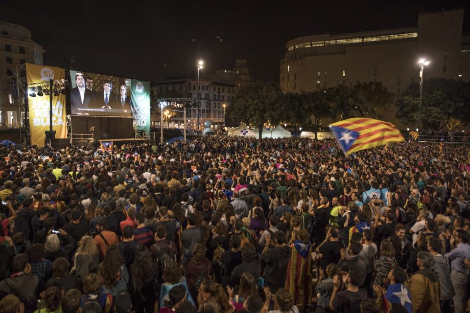 <p>BARCELONA, SPAIN – OCTOBER 01: Crowds listen to Catalan President Carles Puigdemont speak via a televised press conference as they await the result of the Indepenence Referendum at the Placa de Catalunya on October 1, 2017 in Barcelona, Spain. More than five million eligible Catalan voters are estimated to visit 2,315 polling stations today for Catalonia’s referendum on independence from Spain. The Spanish government in Madrid has declared the vote illegal and undemocratic. (Photo by Dan Kitwood/Getty Images) </p>