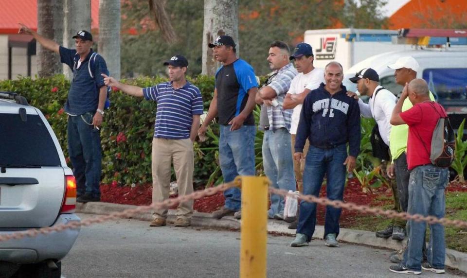 Day laborers try to find work by a Miami-area Home Depot in 2017