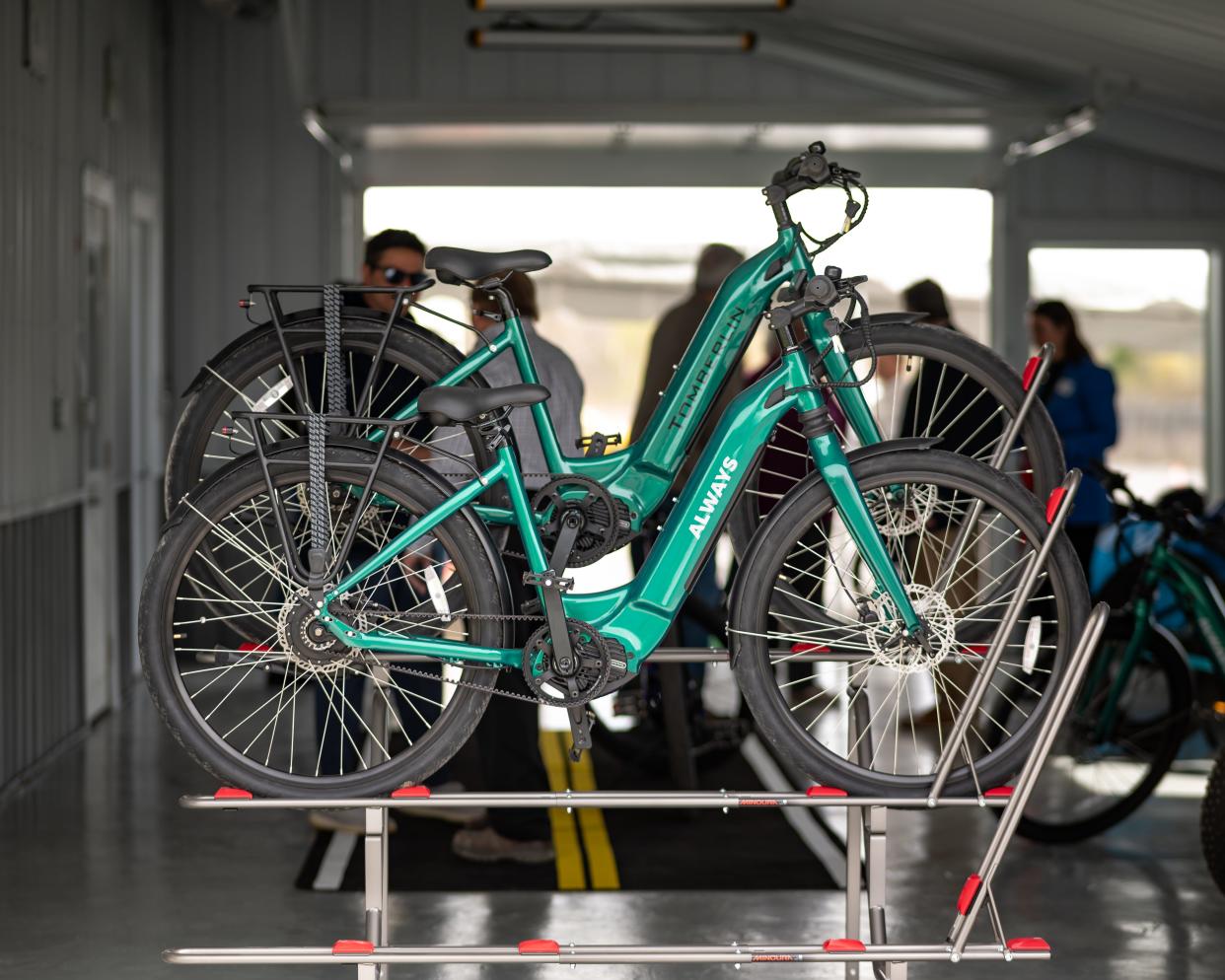 Electric bicycles sit on a rack for display at the new eBliss Experience Center in Clinton, NY on Saturday, April 27, 2024.