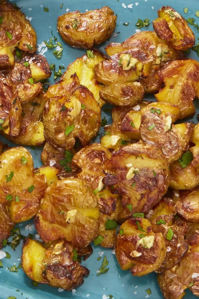 <p>These smashed potatoes crisp up perfectly, and they taste even more delectable when topped with fresh herbs. </p><p><strong><a href="https://www.womansday.com/food-recipes/food-drinks/a25362713/crispy-smashed-potatoes-with-fresh-herbs-recipe/" rel="nofollow noopener" target="_blank" data-ylk="slk:Get the;elm:context_link;itc:0;sec:content-canvas" class="link "><em>Get the </em></a></strong><em><strong><a href="https://www.womansday.com/food-recipes/food-drinks/a25362713/crispy-smashed-potatoes-with-fresh-herbs-recipe/" rel="nofollow noopener" target="_blank" data-ylk="slk:Crispy Smashed Potatoes with Fresh Herbs;elm:context_link;itc:0;sec:content-canvas" class="link ">Crispy Smashed Potatoes with Fresh Herbs</a></strong></em><strong><em><a href="https://www.womansday.com/food-recipes/food-drinks/a25362713/crispy-smashed-potatoes-with-fresh-herbs-recipe/" rel="nofollow noopener" target="_blank" data-ylk="slk:recipe;elm:context_link;itc:0;sec:content-canvas" class="link "> recipe</a>.</em></strong></p>