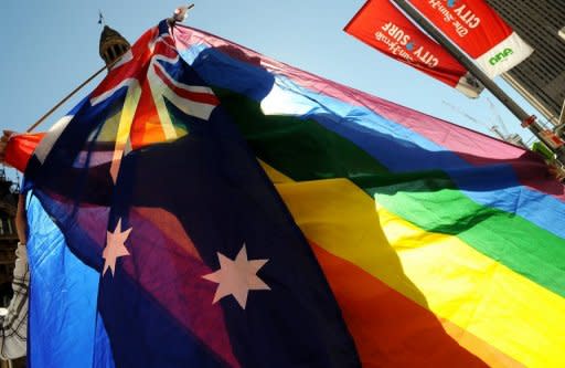 A protester marches through Sydney during a gay rights parade in 2009. Australia's parliament voted overwhelmingly Wednesday to reject gay marriage, after days of heated debate that saw one senator resign from a key role after linking same-sex unions to bestiality