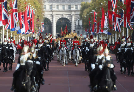 Britain's Queen Elizabeth and King Willem-Alexander of the Netherlands ride the State Coach along the Mall, in London, Britain October 23, 2018. REUTERS/Simon Dawson