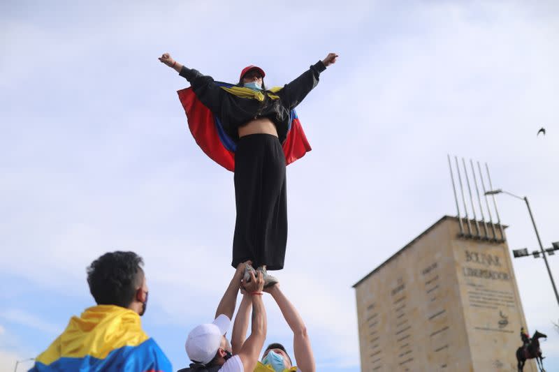 Demonstrators take part in a protest, in Bogota