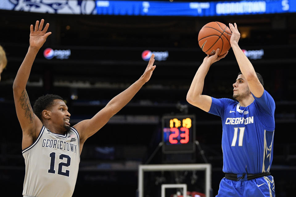 Creighton guard Marcus Zegarowski (11) shoots against Georgetown guard Terrell Allen (12) during the first half of an NCAA college basketball game, Wednesday, Jan. 15, 2020, in Washington. (AP Photo/Nick Wass)