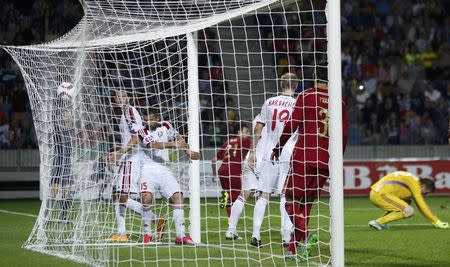 Spain's David Silva (C) scores a goal against Belarus during their Euro 2016 Group C qualifying soccer match at the Borisov Arena stadium outside Minsk, Belarus, June 14, 2015. REUTERS/Vasily Fedosenko