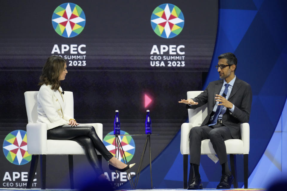 Sundar Pichai, CEO of Google and Alphabet, right, talks to moderator Emily Chang, of Bloomberg, during a discussion entitled "Innovation That Empowers" during the Asia-Pacific Economic Cooperation (APEC) CEO Summit Thursday, Nov. 16, 2023, in San Francisco. (AP Photo/Eric Risberg)