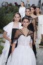 Model Kaia Gerber leads other models as they wear creations for the Chanel Haute Couture Spring/Summer 2020 fashion collection presented Tuesday Jan. 21, 2020 in Paris. (AP Photo/Francois Mori)