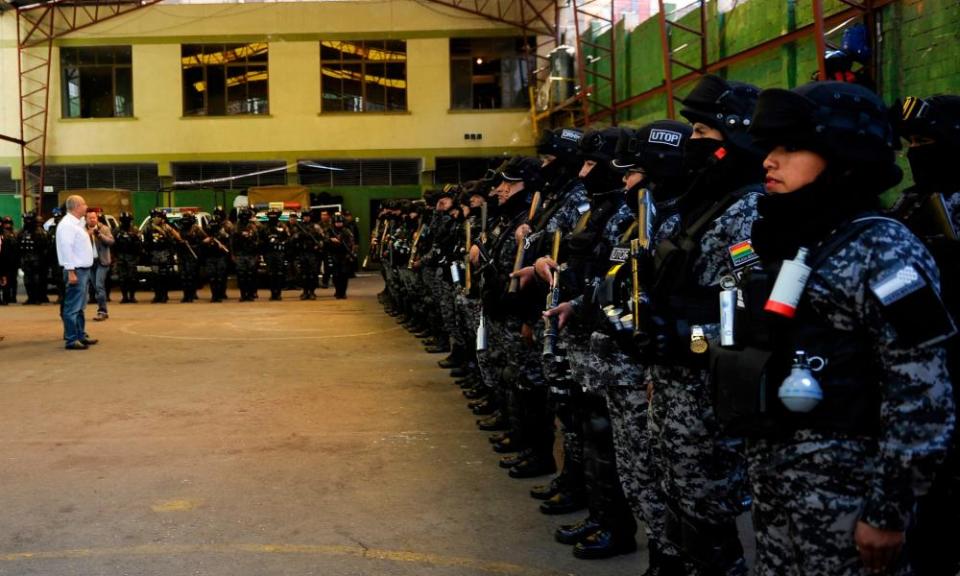 Arturo Murillo (in white shirt) visits the Police Operations Tactical Unit at Murillo square in La Paz in La Paz last week.