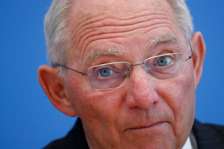 FILE PHOTO: German Finance Minister Wolfgang Schaeuble presents draft budget for 2018 and mid-term plans for state spending until 2021 during a news conference in Berlin, Germany, March 15, 2017. REUTERS/Fabrizio Bensch/File Photo