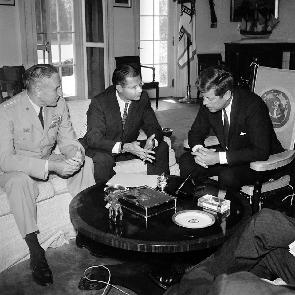U.S. Secretary of Defense Robert McNamara (C) and U.S. Army chief-of-staff General Maxwell Taylor (L) confer on Sept. 24, 1963, at the White House in Washington, D.C., with U.S. President John F. Kennedy prior to their visit to South Vietnam to review U.S. military efforts.<span class="copyright">AFP—Getty Images</span>