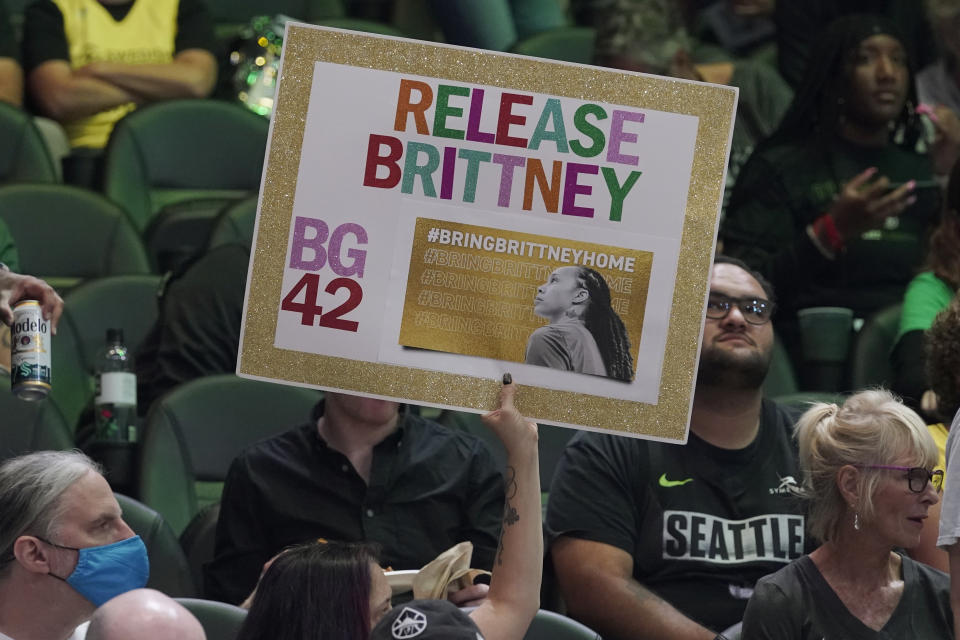 A fan at a WNBA playoff basketball game between the Seattle Storm and the Washington Mystics holds up a sign supporting Phoenix Mercury center Brittney Griner, Sunday, Aug. 21, 2022 in Seattle. Griner is being held in Russia after receiving a nine-year prison sentence for drug possession after police said they found vape canisters containing cannabis oil in her luggage at Moscow's Sheremetyevo Airport earlier in the year. (AP Photo/Ted S. Warren)