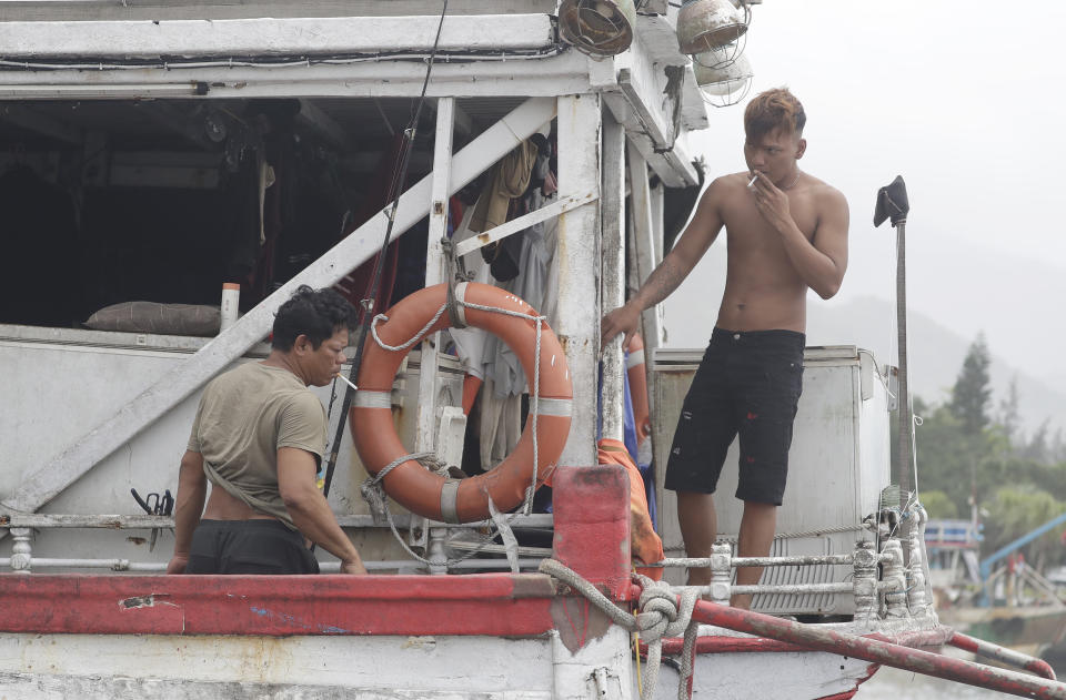 Fishermen stay on a boat while taking shelter as Typhoon Mawar approaches to Taiwan in Yilan County, eastern coast of Taiwan, Tuesday, May 30, 2023. Typhoon Mawar lashed Taiwan's eastern coast on Tuesday with wind, rains and large waves but largely skirted the island after giving a glancing blow to the northern Philippines. (AP Photo/Chiang Ying-ying)