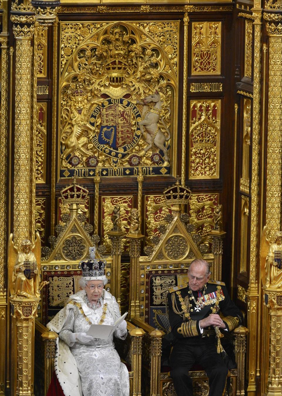 Britain's Queen Elizabeth delivers her speech during the State Opening of Parliament at the House of Lords, alongside Prince Philip in London Wednesday May 8, 2013. The State Opening of Parliament marks the formal start of the parliamentary year, the Queen delivered a speech which set out the government's agenda for the coming year. (AP Photo/Toby Melville, Pool)