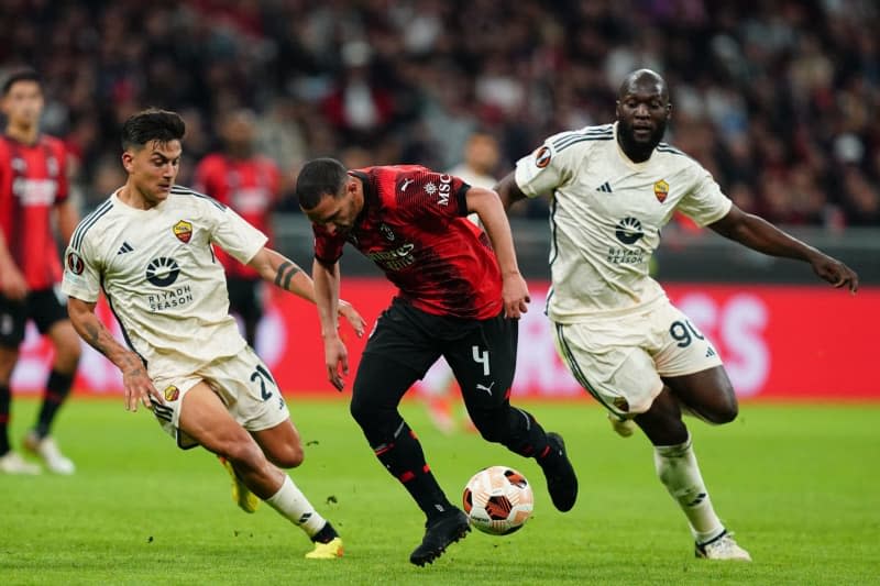 AS Roma's Paulo Dybala, and Romelu Lukaku battle for the ball with AC Milan's Ismael Bennacer during the UEFA Europa League soccer quarter-final first leg soccer match between AC Milan and AS Roma at the San Siro Stadium. -/LaPresse via ZUMA Press/dpa