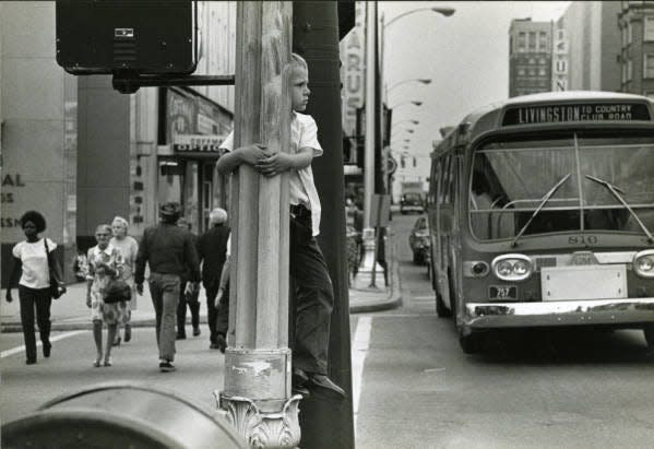 Central Ohio Transit Authority (COTA) buses look different today than this one from the 1970s, when a young boy watched this bus traveling High Street in Columbus.