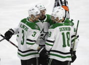 Dallas Stars defenseman John Klingberg (3) celebrates a goal against the Ottawa Senators with defenseman Esa Lindell (23), left wing Jamie Benn (14) and center Jason Dickinson (18) during the first period of an NHL hockey game Sunday, Feb. 16, 2020, in Ottawa, Ontario. (Justin Tang/The Canadian Press via AP)