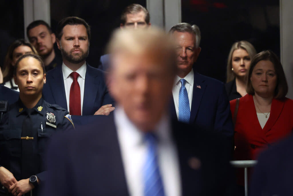 U.S. Senators J.D. Vance and Tommy Tuberville listen as former President Donald Trump speaks to the media outside Manhattan Criminal Court on May 13, 2024